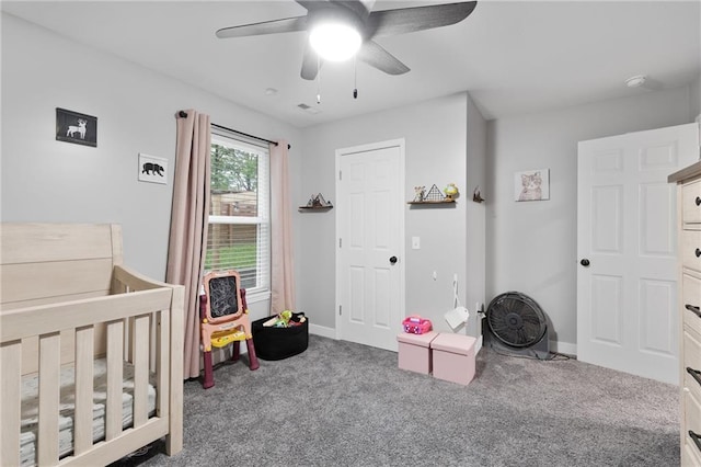 131 Cedar Ct, Warrensburg, MO 64093 - carpeted bedroom with baseboards, ceiling fan, and a nursery area