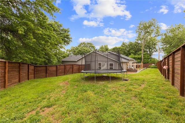 131 Cedar Ct, Warrensburg, MO 64093 - view of yard featuring a trampoline