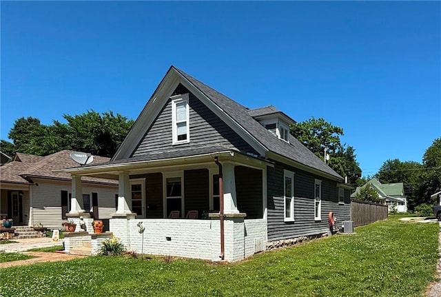 620 S Evergreen Ave, Chanute, KS 66720 - view of property exterior with a lawn, a porch, and a shingled roof