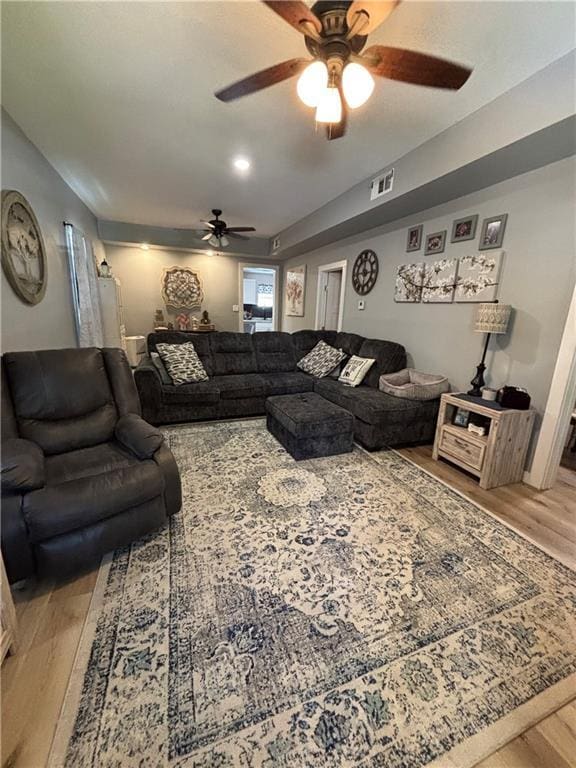 620 S Evergreen Ave, Chanute, KS 66720 - living room featuring a ceiling fan and light wood finished floors