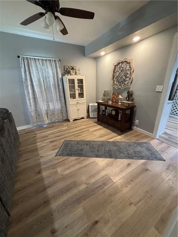 620 S Evergreen Ave, Chanute, KS 66720 - interior space featuring a ceiling fan, wood finished floors, and baseboards