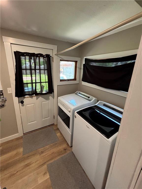 620 S Evergreen Ave, Chanute, KS 66720 - washroom with independent washer and dryer, light wood finished floors, and baseboards
