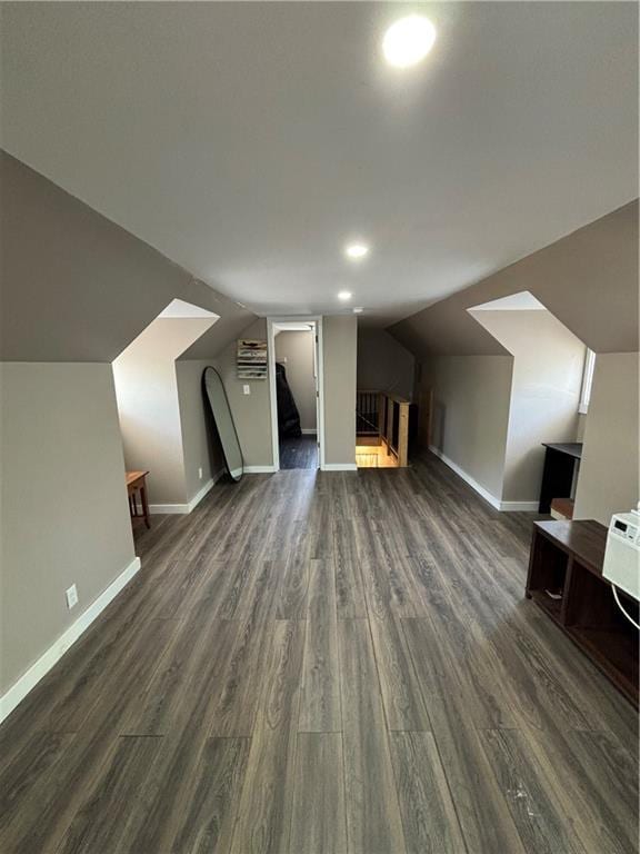 620 S Evergreen Ave, Chanute, KS 66720 - additional living space featuring dark wood-type flooring, baseboards, and vaulted ceiling