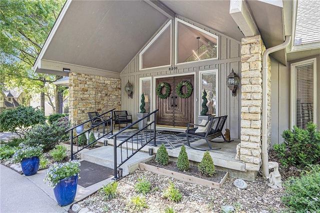 8201 W 100th Ter, Overland Park, KS 66212 - property entrance with stone siding and a porch