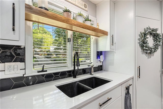 8201 W 100th Ter, Overland Park, KS 66212 - kitchen featuring a sink, white cabinetry, tasteful backsplash, and open shelves
