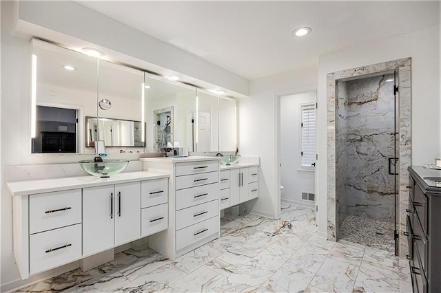 8201 W 100th Ter, Overland Park, KS 66212 - full bath with a marble finish shower, recessed lighting, two vanities, marble finish flooring, and toilet