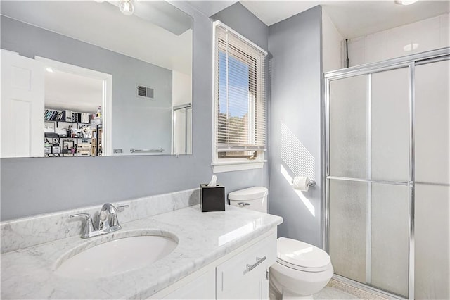 8201 W 100th Ter, Overland Park, KS 66212 - bathroom featuring toilet, a shower stall, and vanity