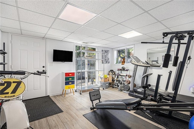 8201 W 100th Ter, Overland Park, KS 66212 - exercise room with wood finished floors and a paneled ceiling