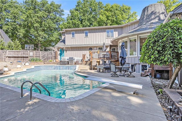 8201 W 100th Ter, Overland Park, KS 66212 - view of swimming pool featuring a patio area, outdoor lounge area, a diving board, and a wooden deck