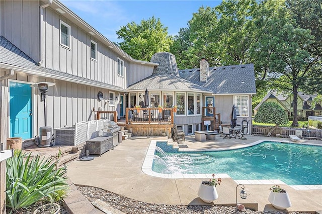 8201 W 100th Ter, Overland Park, KS 66212 - view of swimming pool featuring a wooden deck and a patio