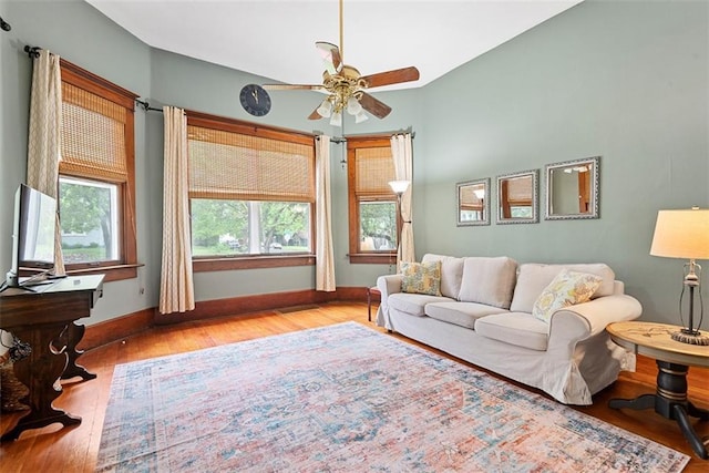 901 S 3rd St, Leavenworth, KS 66048 - living area featuring light wood finished floors, a ceiling fan, and baseboards