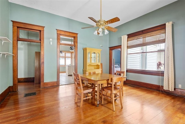 901 S 3rd St, Leavenworth, KS 66048 - dining space with ceiling fan, wood finished floors, and baseboards