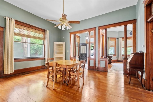 901 S 3rd St, Leavenworth, KS 66048 - dining area featuring hardwood / wood-style floors, a ceiling fan, decorative columns, and baseboards