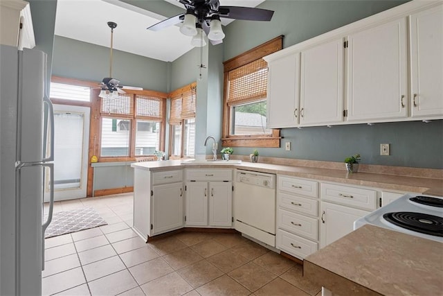901 S 3rd St, Leavenworth, KS 66048 - kitchen with white appliances, ceiling fan, a sink, white cabinets, and light tile patterned floors