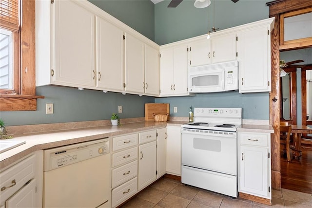 901 S 3rd St, Leavenworth, KS 66048 - kitchen featuring white appliances, light countertops, and white cabinets