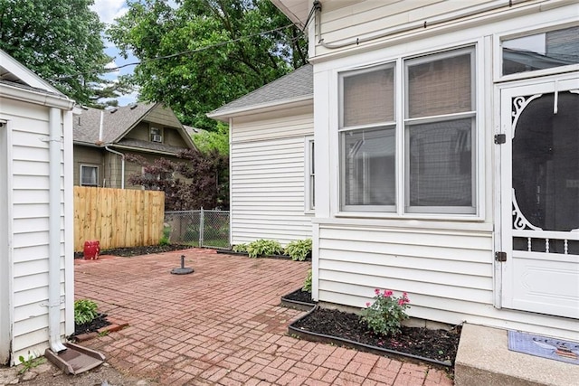 901 S 3rd St, Leavenworth, KS 66048 - entrance to property featuring a patio and roof with shingles