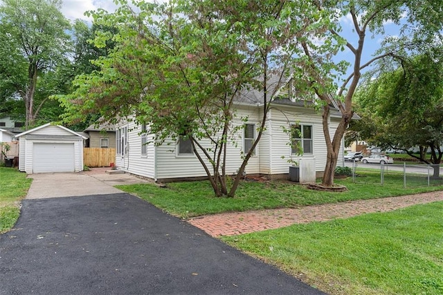 901 S 3rd St, Leavenworth, KS 66048 - obstructed view of property with driveway, an outdoor structure, and a garage