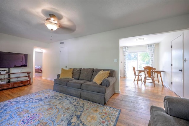 5815 W 70th St, Overland Park, KS 66208 - living room featuring wood finished floors and ceiling fan