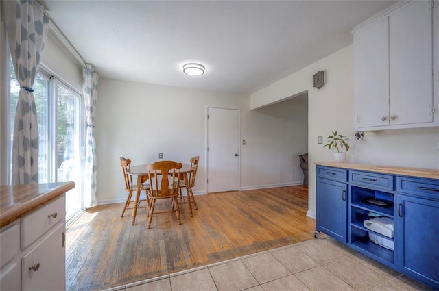 5815 W 70th St, Overland Park, KS 66208 - dining area with light wood-type flooring and baseboards