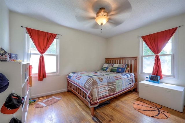5815 W 70th St, Overland Park, KS 66208 - bedroom featuring wood finished floors and a ceiling fan