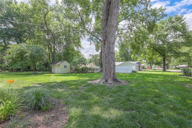 5815 W 70th St, Overland Park, KS 66208 - fenced backyard with a storage unit and view of wooded area