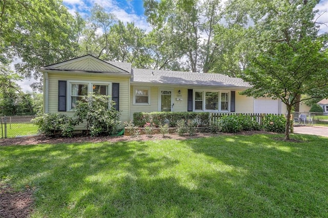 5815 W 70th St, Overland Park, KS 66208 - ranch-style house with an attached garage and driveway
