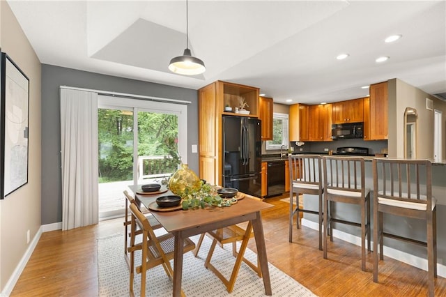 3601 NW 56th St, Houston Lake, MO 64151 - dining space featuring healthy amount of natural light, light wood-type flooring, recessed lighting, and baseboards