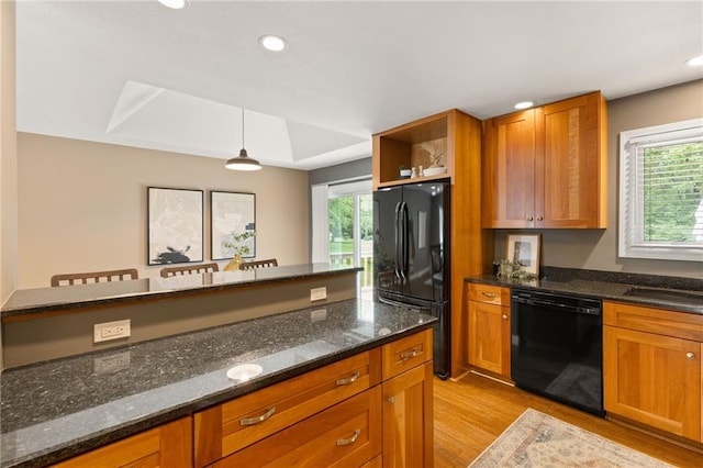 3601 NW 56th St, Houston Lake, MO 64151 - kitchen featuring black appliances, light wood-type flooring, healthy amount of natural light, brown cabinetry, and recessed lighting
