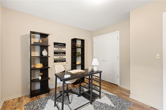 3601 NW 56th St, Houston Lake, MO 64151 - office area featuring wood finished floors and baseboards