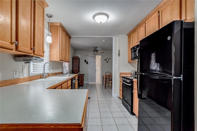 1501 Osage St, Leavenworth, KS 66048 - kitchen with black appliances, a sink, ceiling fan, light tile patterned floors, and light countertops