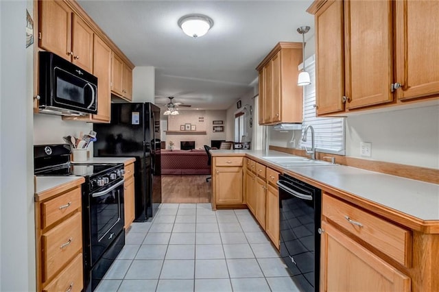 1501 Osage St, Leavenworth, KS 66048 - kitchen with black appliances, a ceiling fan, a sink, open floor plan, and light countertops