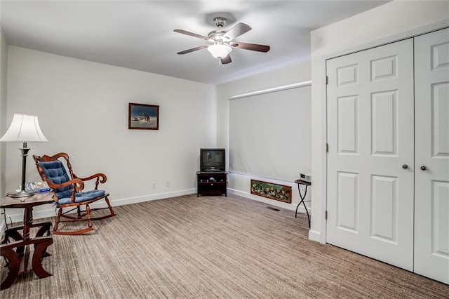 1501 Osage St, Leavenworth, KS 66048 - living area featuring ceiling fan, baseboards, and carpet floors