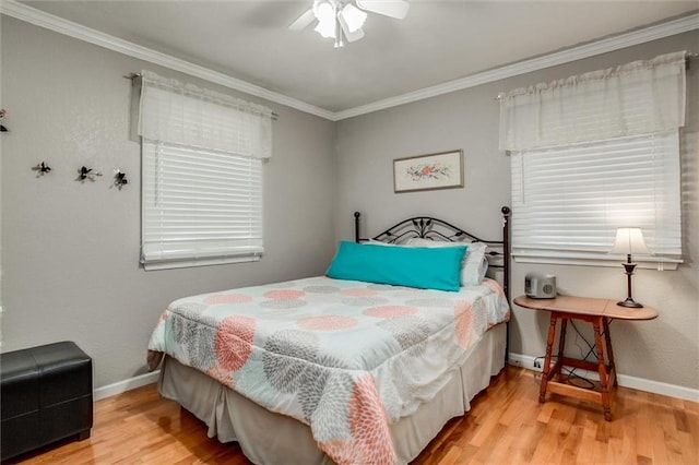1501 Osage St, Leavenworth, KS 66048 - bedroom featuring ornamental molding, baseboards, wood finished floors, and a ceiling fan