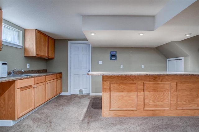 1501 Osage St, Leavenworth, KS 66048 - kitchen with a sink, light colored carpet, white microwave, recessed lighting, and baseboards