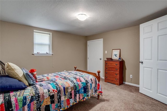 1501 Osage St, Leavenworth, KS 66048 - bedroom featuring carpet flooring, a textured ceiling, and baseboards