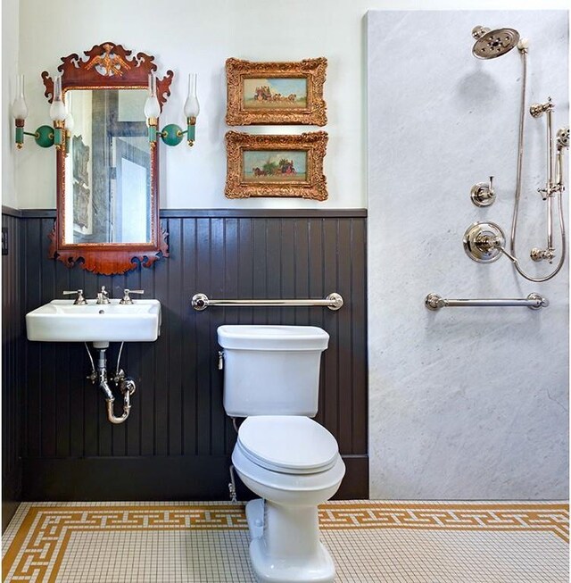 20400 280th Trl, Malta Bend, MO 65339 - bathroom featuring toilet, wainscoting, and a sink