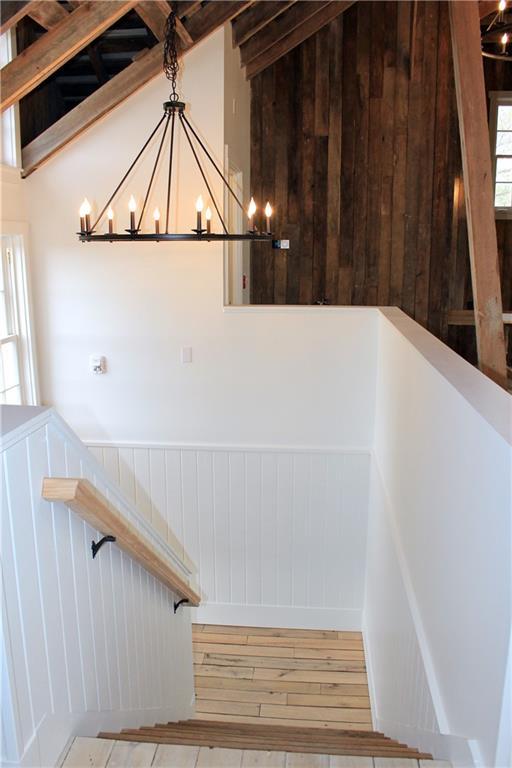 20400 280th Trl, Malta Bend, MO 65339 - stairs with a chandelier and hardwood / wood-style floors