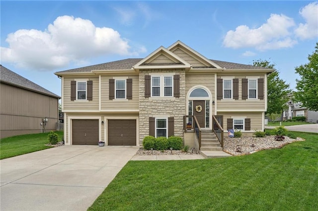 10136 N Wallace Ave, Kansas City, MO 64157 - bi-level home with driveway, a front yard, stone siding, and an attached garage