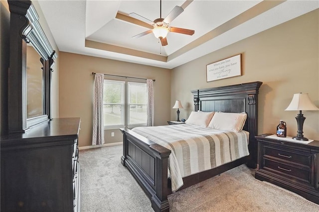 10136 N Wallace Ave, Kansas City, MO 64157 - bedroom with light carpet, a raised ceiling, baseboards, and ceiling fan