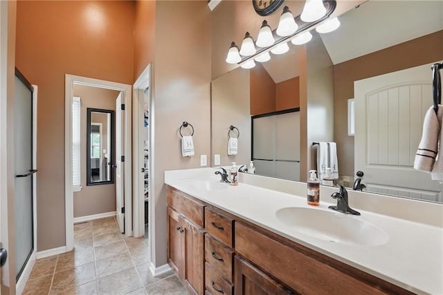 10136 N Wallace Ave, Kansas City, MO 64157 - full bathroom featuring double vanity, baseboards, and tile patterned flooring