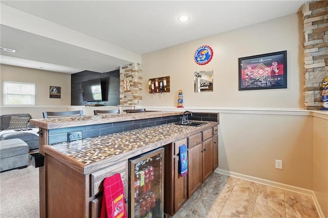 10136 N Wallace Ave, Kansas City, MO 64157 - bar area with wine cooler, a sink, recessed lighting, and baseboards