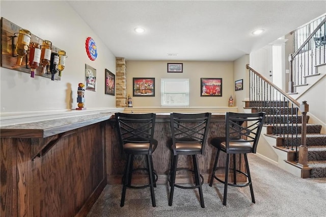 10136 N Wallace Ave, Kansas City, MO 64157 - indoor bar featuring carpet, stairs, and recessed lighting