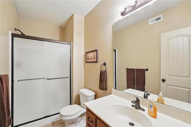 10136 N Wallace Ave, Kansas City, MO 64157 - full bathroom with a shower stall, toilet, and vanity