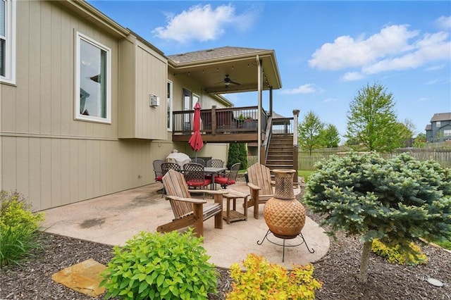 10136 N Wallace Ave, Kansas City, MO 64157 - view of patio / terrace featuring stairway, a wooden deck, outdoor dining space, and a ceiling fan