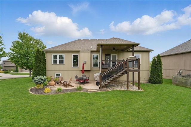 10136 N Wallace Ave, Kansas City, MO 64157 - back of house featuring a ceiling fan, stairs, a lawn, a patio, and a shingled roof