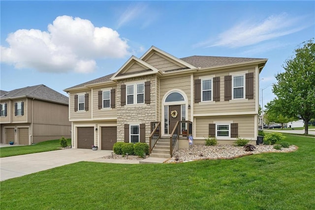 10136 N Wallace Ave, Kansas City, MO 64157 - raised ranch featuring an attached garage, driveway, a front lawn, and stone siding