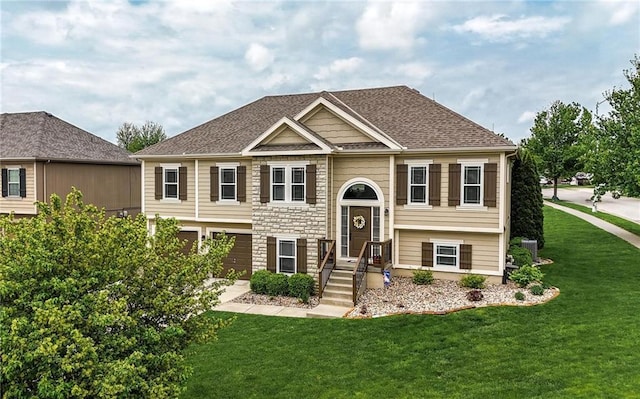10136 N Wallace Ave, Kansas City, MO 64157 - bi-level home featuring a front lawn, stone siding, and roof with shingles