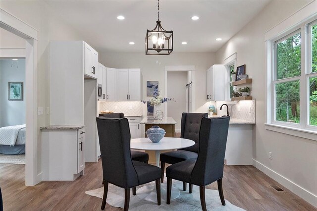 18 Beechwood Ln, Linn Valley, KS 66040 - dining room featuring a chandelier, light wood finished floors, recessed lighting, and baseboards