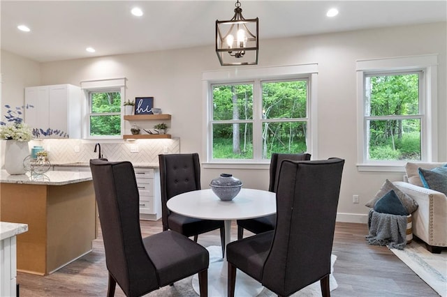 18 Beechwood Ln, Linn Valley, KS 66040 - dining space with healthy amount of natural light, recessed lighting, light wood-type flooring, a chandelier, and baseboards