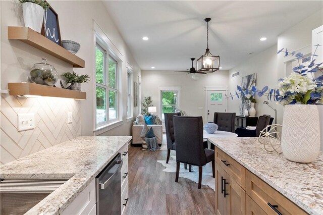 18 Beechwood Ln, Linn Valley, KS 66040 - kitchen with open shelves, wood finished floors, hanging light fixtures, stainless steel dishwasher, and light stone counters
